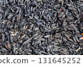 Burned and carbonized husks from newly threshed rice 131645252