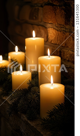 Cozy Hygge Christmas Fireplace Mantel with Glowing Pillar Candles and Evergreen Garland 131645300