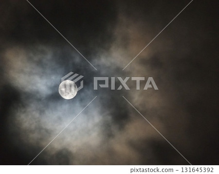 The moon hidden in the clouds 131645392