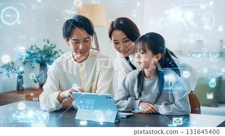 Parents and children looking at tablets and digital technology Parents and children looking at tablets and digital technology 131645400