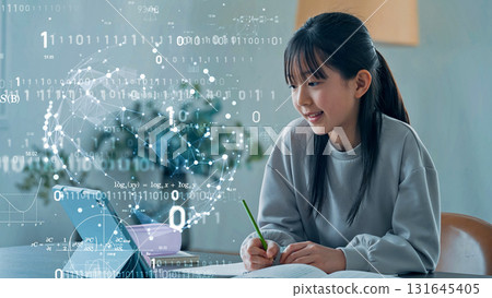 Girl studying while looking at tablet and digital technology e-learning Girl studying while looking at tablet and digital technology e-learning 131645405
