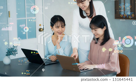 Group of women working in an office and business data Group of women working in an office and business data 131645441