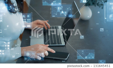 Woman using a laptop and digital technology image 131645451