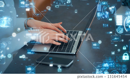 Woman using a laptop and digital technology image 131645454