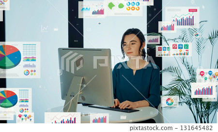 A woman using a computer and digital documents in the office A woman using a computer and digital documents in the office 131645482
