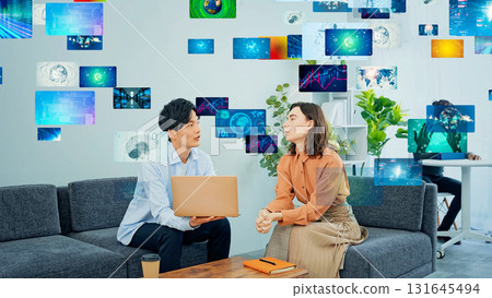 Multinational group talking in office and digital content Multinational group talking in office and digital content 131645494