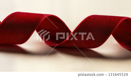 Luxurious Red Velvet Ribbon Flowing Elegantly for a Festive Christmas Celebration Background Luxurious Red Velvet Ribbon Flowing Elegantly for a Festive Christmas Celebration Background 131645529
