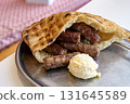 Sarajevo-style cevapi aka Sarajevski cevapi a national dish of Bosnia and Herzegovina 131645589