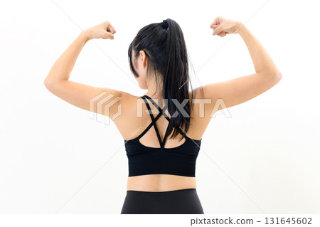 Cool woman working out, double biceps, female back muscles, muscle training, sports bra, white background Cool woman working out, double biceps, female back muscles, muscle training, sports bra, white background 131645602