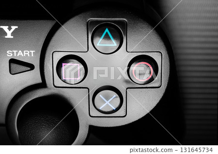16 February 2012, Poland, Wroclaw. Black DualShock 3 wireless controller, a gamepad for the PlayStation 3, a home video game console produced by Sony Computer Entertainment, on dark background. 16 February 2012, Poland, Wroclaw. Black DualShock 3 wireless controller, a gamepad for the PlayStation 3, a home video game console produced by Sony Computer Entertainment, on dark background. 131645734