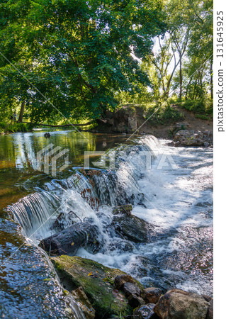 The beauty of a waterfall in the forest The beauty of a waterfall in the forest 131645925