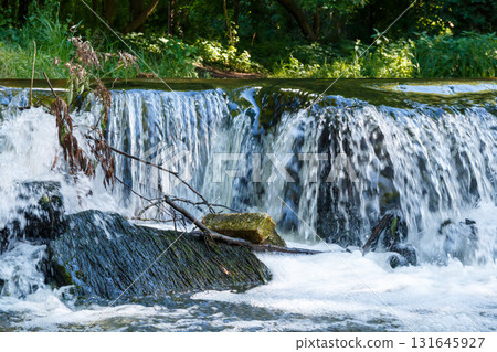 The beauty of a waterfall in the forest The beauty of a waterfall in the forest 131645927