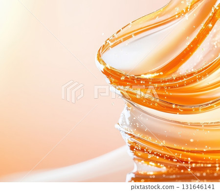 Mesmerizing splash of molten golden caramel in a ribbon like dynamic flow on an elegant shiny background  This abstract close up image captures the luxurious 131646141