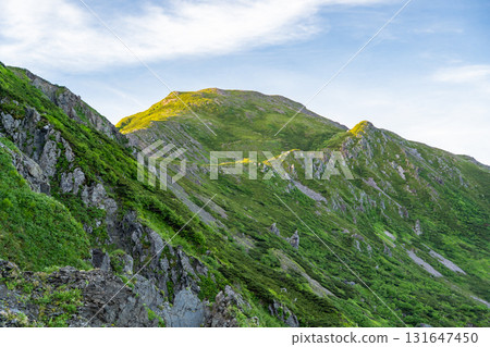 View of the morning glow of Mt. Kamikawachi from Mt. Minami in the Southern Alps. Climbing Mt. Hijiri in the Southern Alps View of the morning glow of Mt. Kamikawachi from Mt. Minami in the Southern Alps. Climbing Mt. Hijiri in the Southern Alps 131647450
