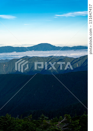 View of Mt. Ena in the morning glow from Mt. Minami (Seihei) in the Southern Alps. Climbing Mt. Seihei in the Southern Alps View of Mt. Ena in the morning glow from Mt. Minami (Seihei) in the Southern Alps. Climbing Mt. Seihei in the Southern Alps 131647457