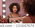 1980s woman with curly hair and lipstick at glowing vanity mirror 131647674
