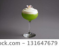 Vibrant green matcha fizz cocktail crowned with velvety cream foam 131647679