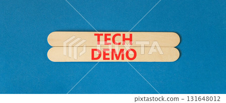 Tech demo symbol. Concept word Tech demo on beautiful wooden sticks. Beautiful blue paper background. Business tech demo concept. Copy space. 131648012