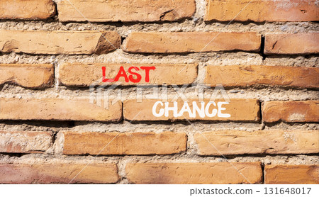 Last chance symbol. Concept word Last chance on beautiful old brown brick wall. Beautiful old brown brick wall background. Old brick wall. Business last chance concept. Copy space. Last chance symbol. Concept word Last chance on beautiful old brown brick wall. Beautiful old brown brick wall background. Old brick wall. Business last chance concept. Copy space. 131648017
