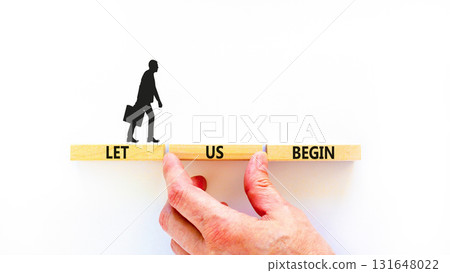 Let us begin symbol. Concept words Let us begin on beautiful wooden blocks. Beautiful white background. Businessman hand. Business motivational let us begin concept. Copy space. Let us begin symbol. Concept words Let us begin on beautiful wooden blocks. Beautiful white background. Businessman hand. Business motivational let us begin concept. Copy space. 131648022