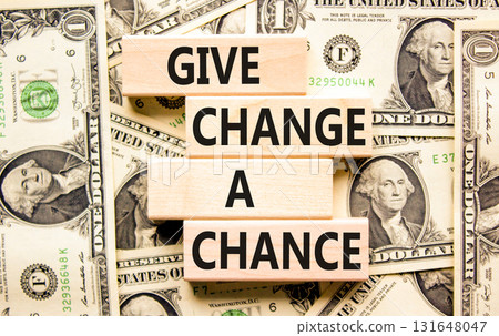 Give change a chance symbol. Concept words phrase Give change a chance on beautiful wooden blocks. Dollar bills. Beautiful dollar bills background. Business Give change a chance concept. Copy space. Give change a chance symbol. Concept words phrase Give change a chance on beautiful wooden blocks. Dollar bills. Beautiful dollar bills background. Business Give change a chance concept. Copy space. 131648047