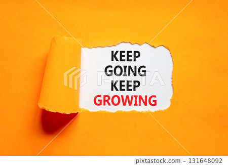 Keep going and growing symbol. Concept words phrase Keep going keep growing on beautiful white paper. Beautiful orange paper background. Business Keep going and growing concept. Copy space. 131648092