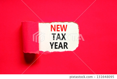 New tax year symbol. Concept words New tax year on beautiful white paper. Beautiful red table red background. Business new tax year concept. Copy space. 131648095