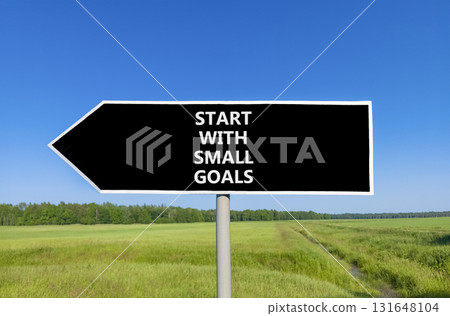Start with small goals symbol. Concept words phrase Start with small goals on beautiful road sign. Beautiful blue sky green grass lawn background. Business Start with small goals concept. Copy space. 131648104
