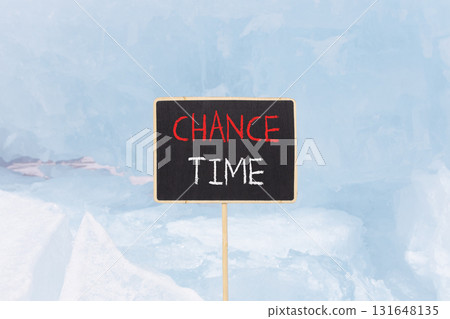 Chance time symbol. Concept word Chance time on beautiful black blackboard. Beautiful blue Baikal ice and snow background. Black blackboard. Business chance time concept. Copy space. 131648135