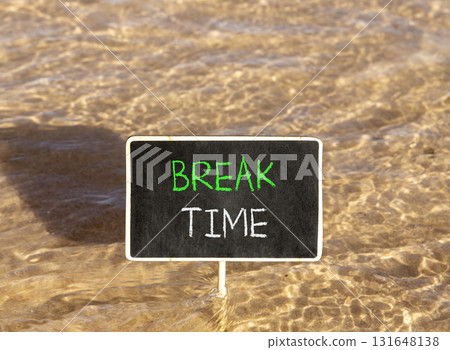 Break time symbol. Concept word Break time on beautiful black blackboard. Beautiful Red sea water background. Black blackboard. Business break time concept. Copy space. Break time symbol. Concept word Break time on beautiful black blackboard. Beautiful Red sea water background. Black blackboard. Business break time concept. Copy space. 131648138