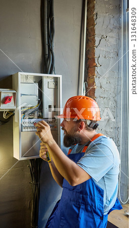 Technician explaining electrical system maintenance process Technician explaining electrical system maintenance process 131648309