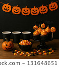 Halloween Party Table with Cupcakes and Candy 131648651