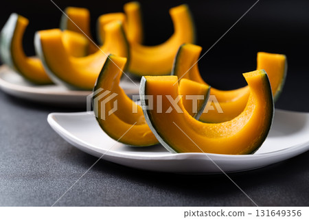 Steamed Japanese pumpkin or Kabocha on plate ready to eating, Healthy food 131649356