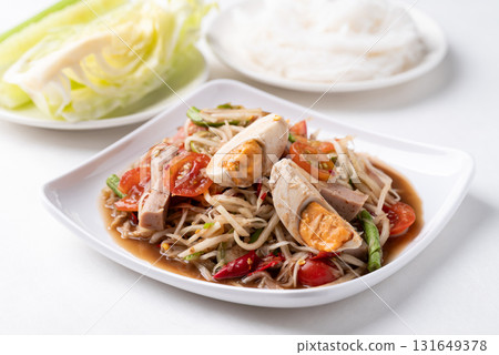 Thai food (Som Tum), Spicy papaya salad with steamed pork sausage and salted egg 131649378