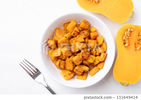 Top view of roasted butternut squash pumpkin in a bowl on white background, Autumn homemade food Top view of roasted butternut squash pumpkin in a bowl on white background, Autumn homemade food 131649414