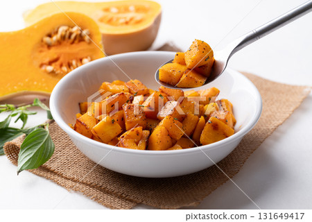 Roasted butternut squash pumpkin in a bowl with spoon, Autumn homemade food 131649417