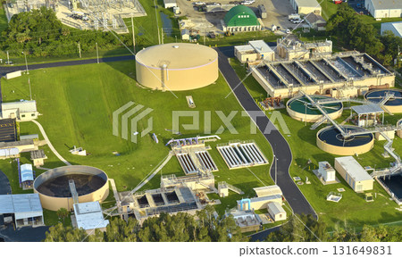 Aerial view of modern water cleaning facility at urban wastewater treatment plant. Purification process of removing undesirable chemicals, suspended solids and gases from contaminated liquid 131649831