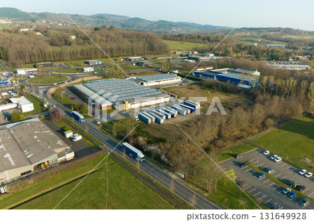 Aerial view of goods warehouses and logistics center in industrial city zone from above 131649928