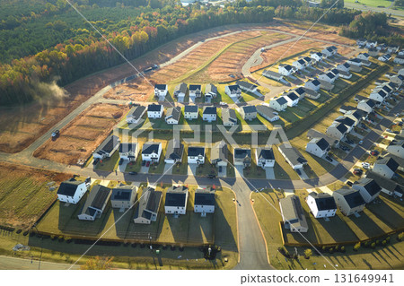 Aerial view of construction site with new tightly packed homes in South Carolina. Family houses as example of real estate development in american suburbs Aerial view of construction site with new tightly packed homes in South Carolina. Family houses as example of real estate development in american suburbs 131649941