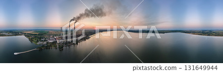Aerial view of coal power plant high pipes with black smokestack polluting atmosphere. Electricity production with fossil fuel concept Aerial view of coal power plant high pipes with black smokestack polluting atmosphere. Electricity production with fossil fuel concept 131649944