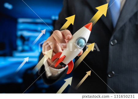 A businessman launches a business rocket into the air. Concept for launching a business or startup. Innovation, entrepreneurship, new projects, growth potential, and success strategy. A businessman launches a business rocket into the air. Concept for launching a business or startup. Innovation, entrepreneurship, new projects, growth potential, and success strategy. 131650231