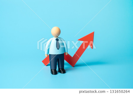 Office worker and red arrow on graph pointing up. Increase in workers' wages. Salaries and taxes on workers. Concept of economic growth, labor market trends, and payroll management. 131650264