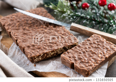 Chocolate nougat bar with puffed rice 131650505