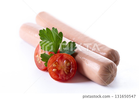 Raw Frankfurt sausages with cherry tomatoes and parsley Raw Frankfurt sausages with cherry tomatoes and parsley 131650547