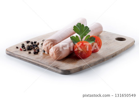 Raw Frankfurt sausages with cherry tomatoes and parsley 131650549