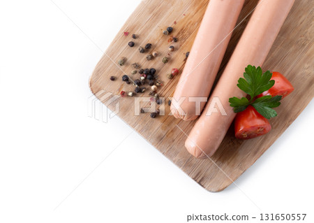 Raw Frankfurt sausages with cherry tomatoes and parsley Raw Frankfurt sausages with cherry tomatoes and parsley 131650557