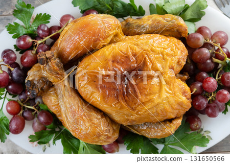 Roast turkey with grapes and parsley Roast turkey with grapes and parsley 131650566