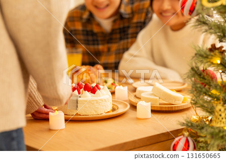 Family having a Christmas home party 131650665