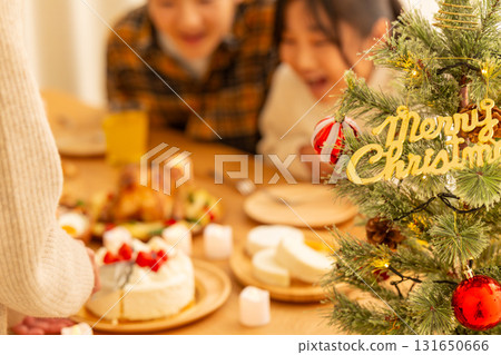 Family having a Christmas home party Family having a Christmas home party 131650666