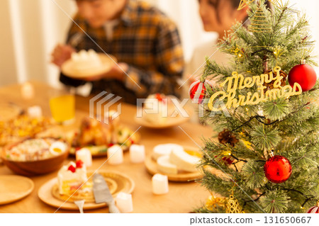 Family having a Christmas home party Family having a Christmas home party 131650667